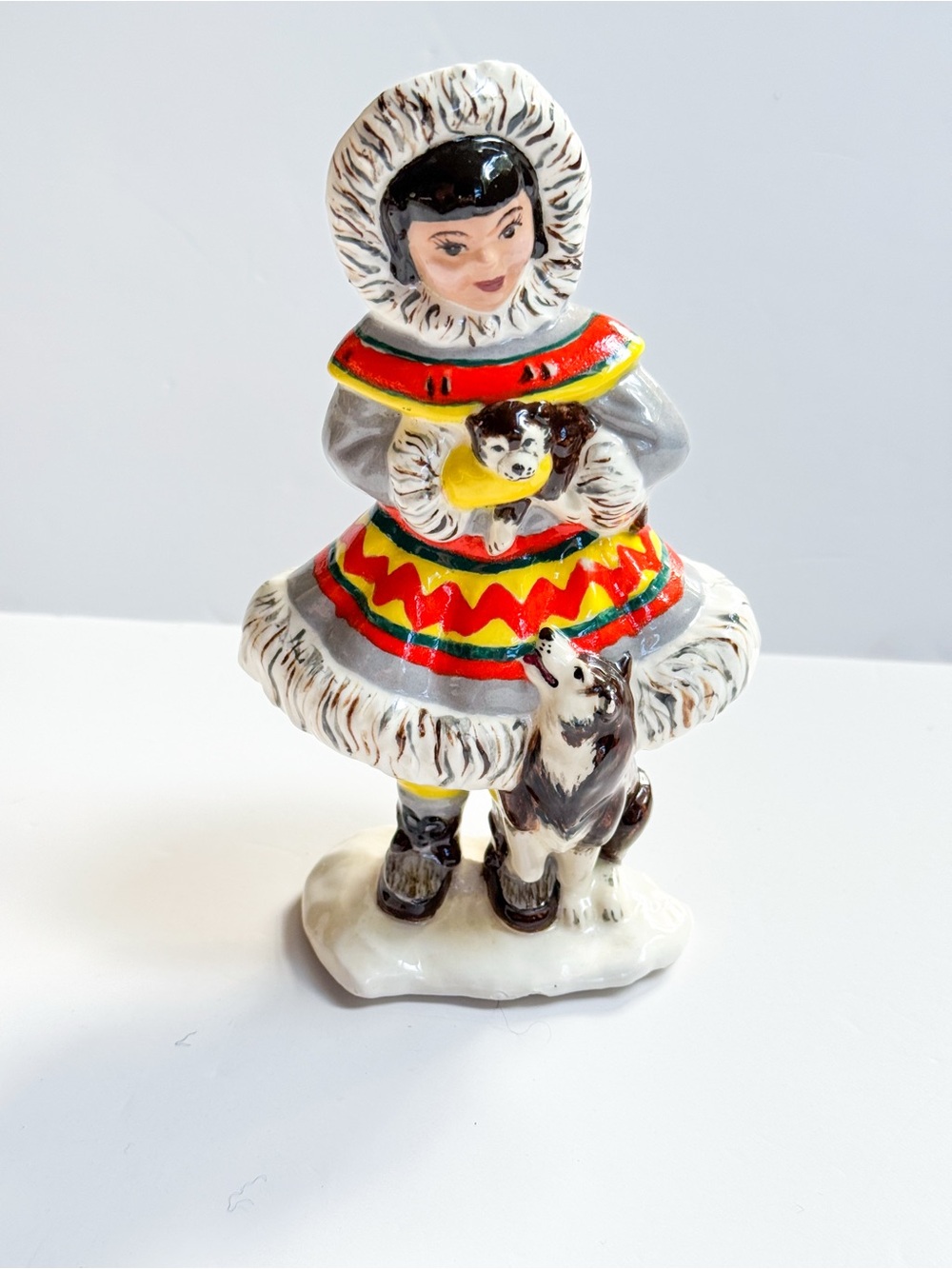 Hand Painted Vintage 1984 Ceramic Inuit Eskimo Girl Figurine with Huskies Dogs